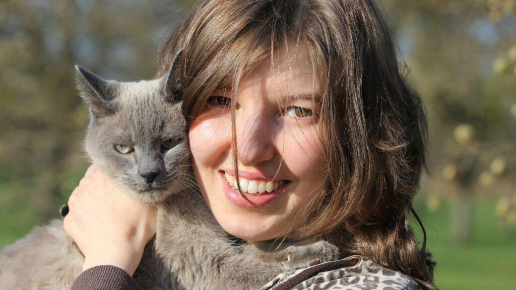 Woman Holding a Grey Cat